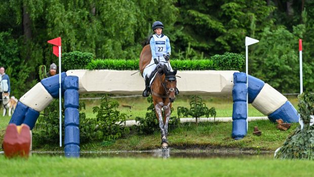 British rider Ros Canter and Izilot DHI jumping clear in the Luhmühlen Horse Trials CCI5* cross-country to hold their lead.